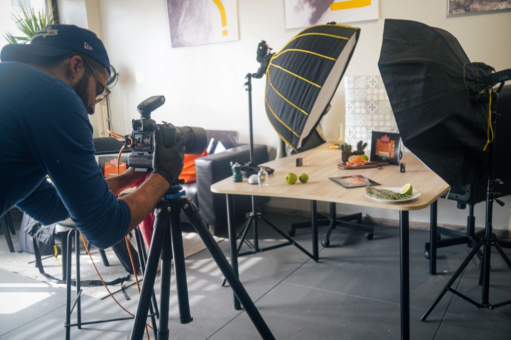 Photographer capturing a packshot in Packtory®’s studio, specializing in packaging design.